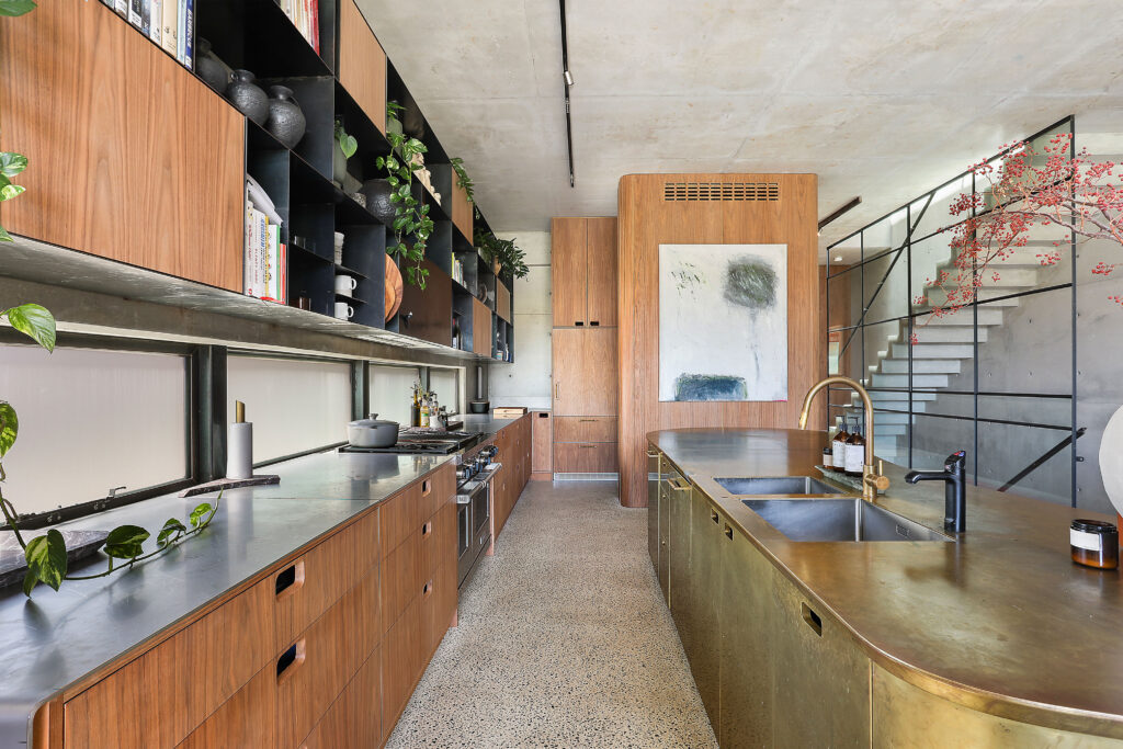 industrial urban kitchen with gold and wood