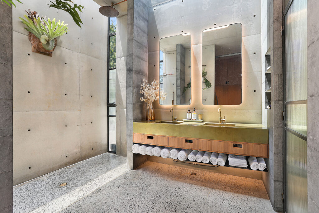industrial urban bathroom with gold and wood